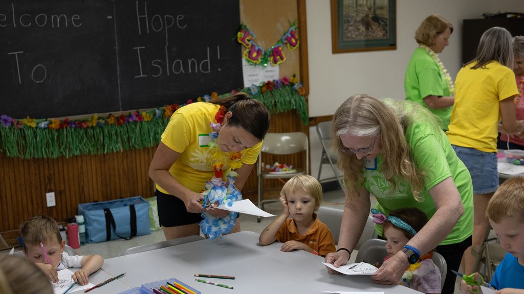 Volunteers helping kids
