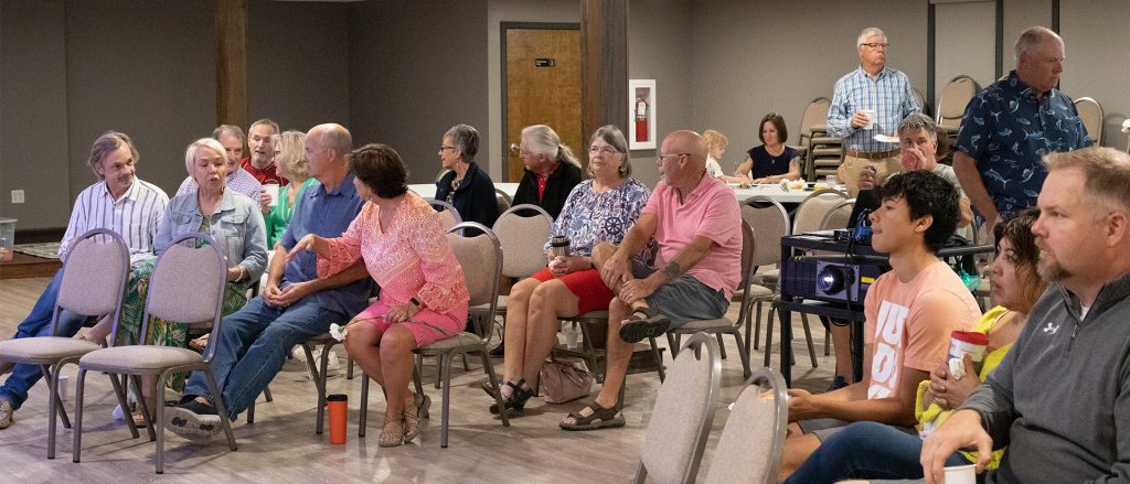 Group at worship greeting one another