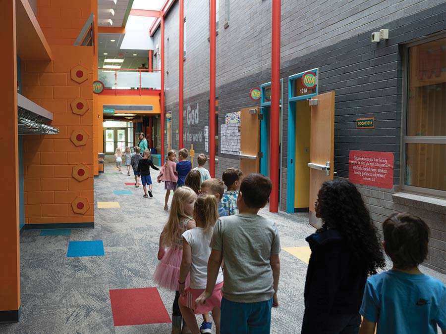 Preschool class walking in hallway