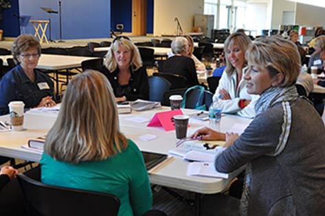 Women discussing sermon series in a small group