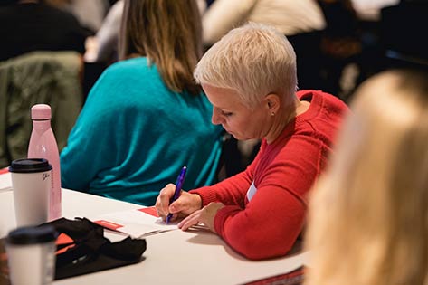 Woman taking notes for daily devotions