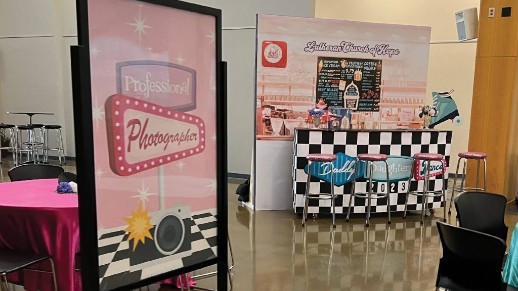 Photo of decor from and photo backdrops from the diner 50s theme.