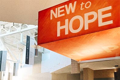 New to Hope sign in West Des Moines building atrium
