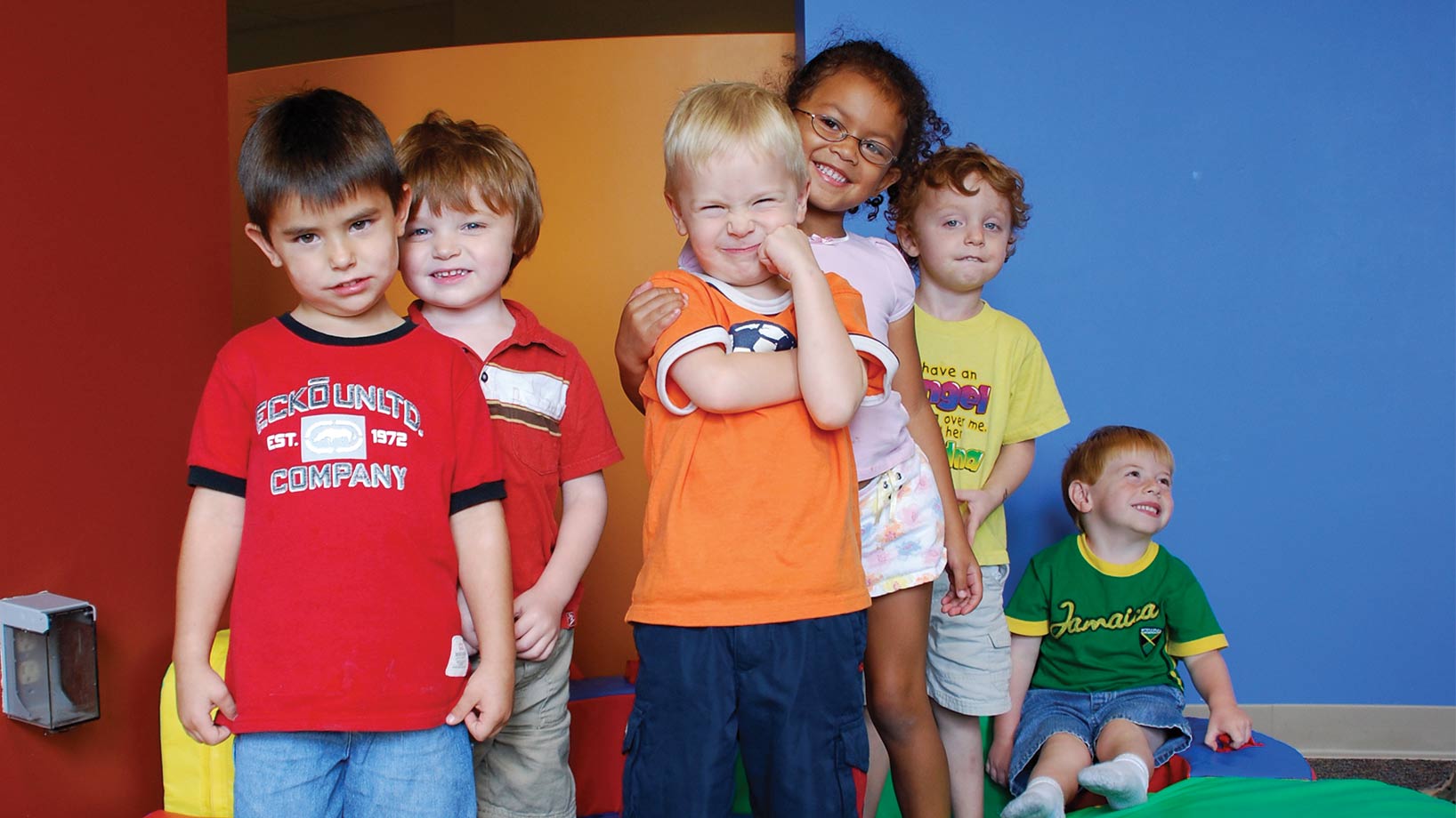 Group of kids smiling in the nursery