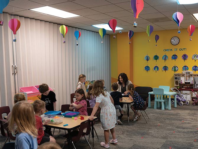 Students participating in various activities within a classroom