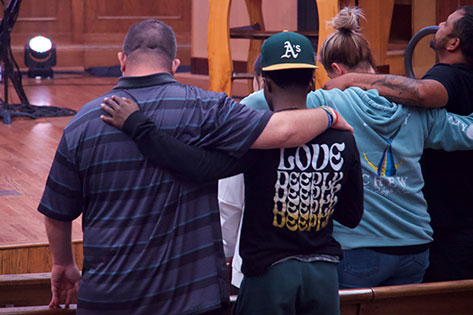 men praying together