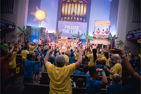 people praising and worshipping God at VBS