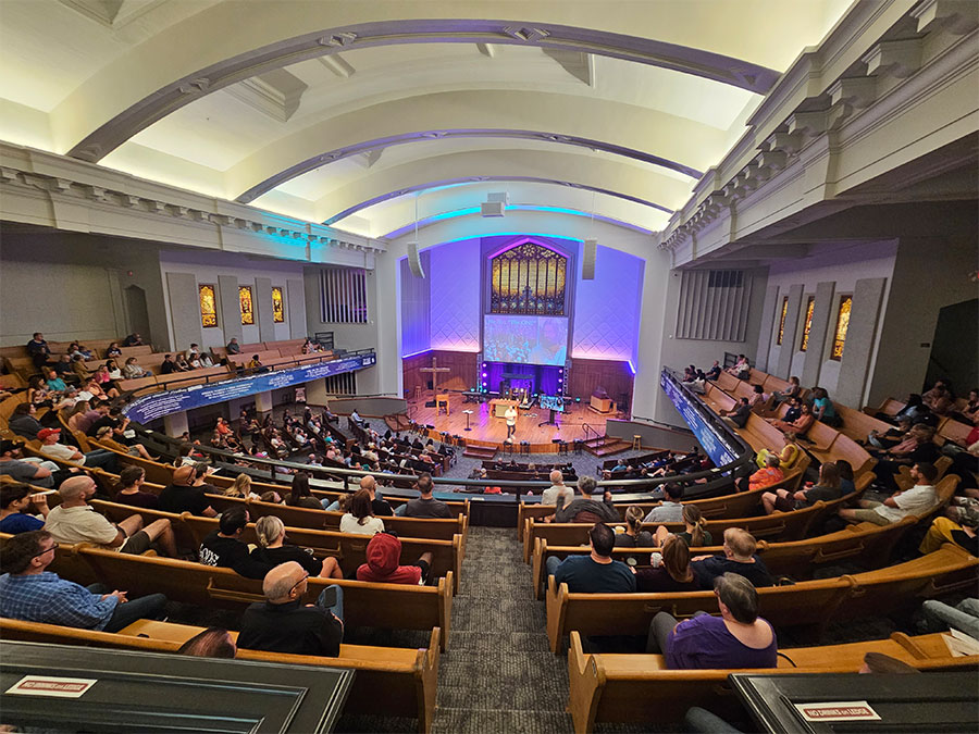 worship center of people listening to sermons