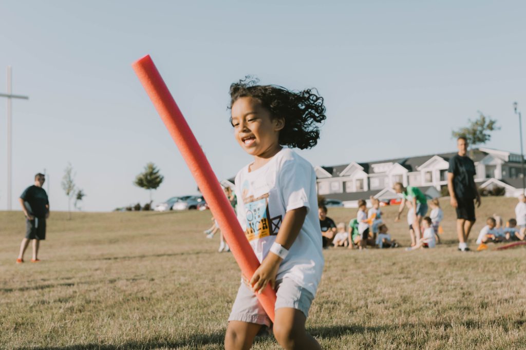 Student playing outside during Vacation Bible School 2022