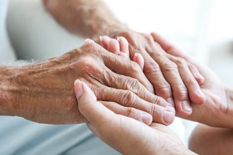 Two people holding hands