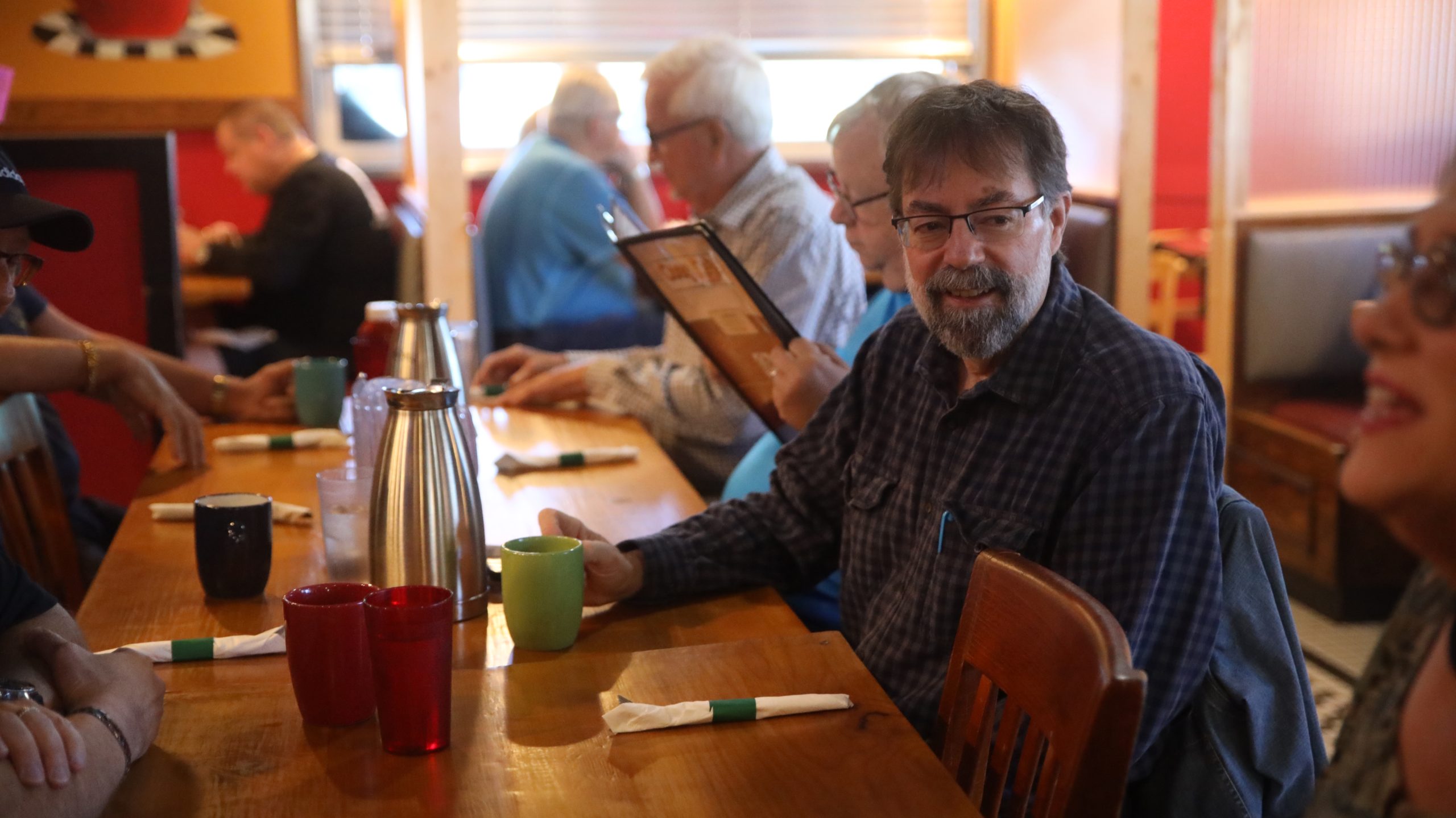 Member of our 50+ ministry spending time in fellowship and community at a local cafe