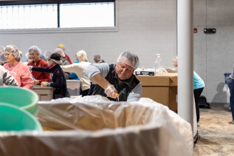 Volunteers sorting bins